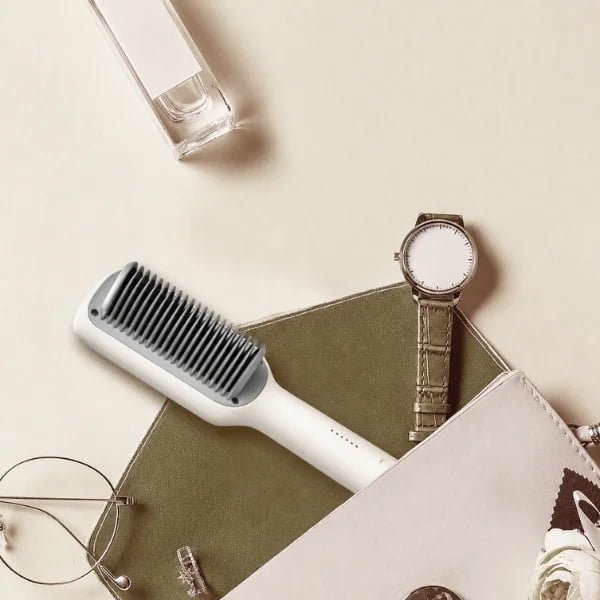 KD680 corded hair straightening brush in an everyday styling flat lay