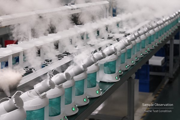 B2B facial steamer steam stability sample test Image showing multiple identical facial steamer samples on a level test bench with measured water fill, timers, sample IDs, and a fixed observation position