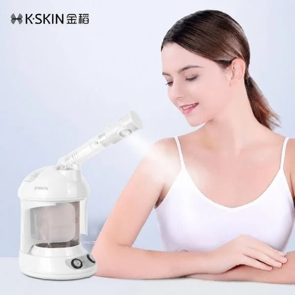 Woman beside the KD2328 facial steamer for home skincare use