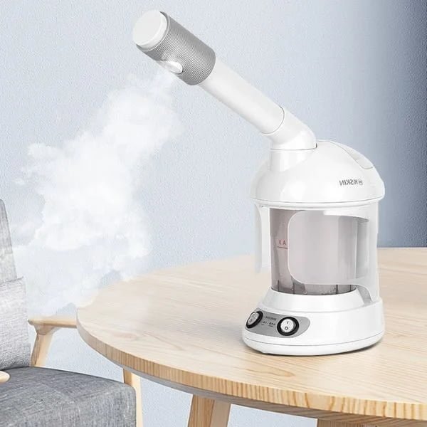 KD2328A facial steamer producing visible steam from the spray nozzle on a table