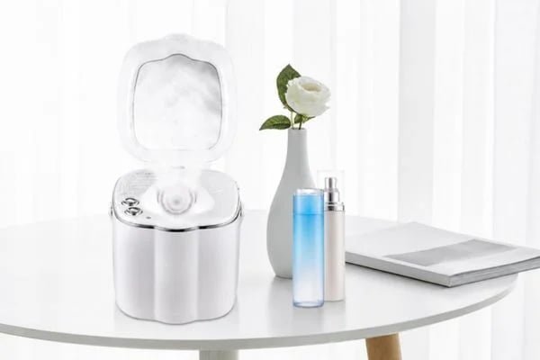 KD2332 facial steamer displayed with skincare products in a home setting