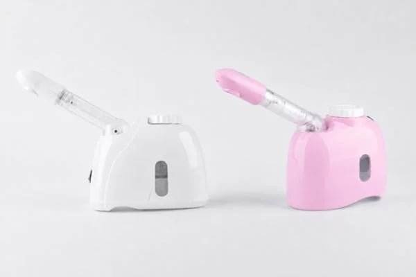 White and pink KD33S facial steamer color options