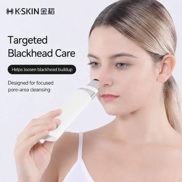 Woman using KD8023 ultrasonic skin scrubber for targeted pore-area cleansing around the nose