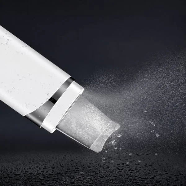 Close-up of KD8023 stainless-steel spatula with ultrasonic vibration and water effect