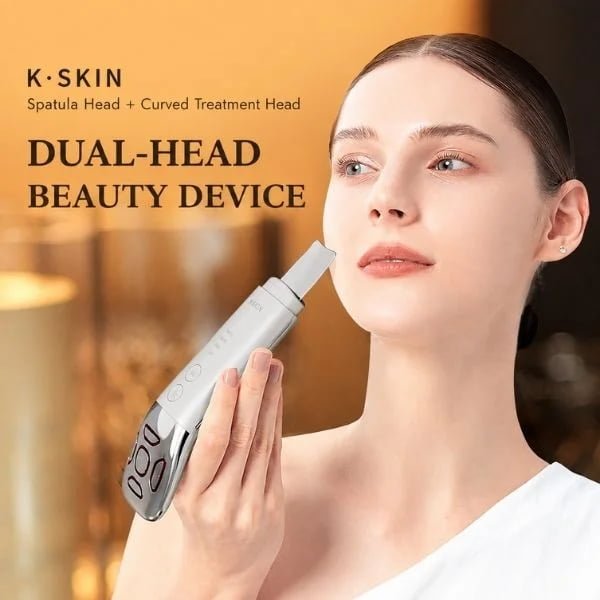 Woman holding the KD8086 dual-head beauty device with spatula and curved treatment heads