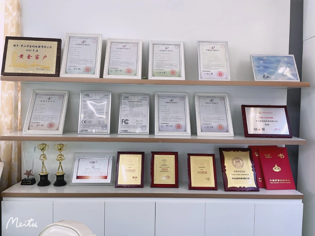 Framed certificates and awards arranged on display shelves